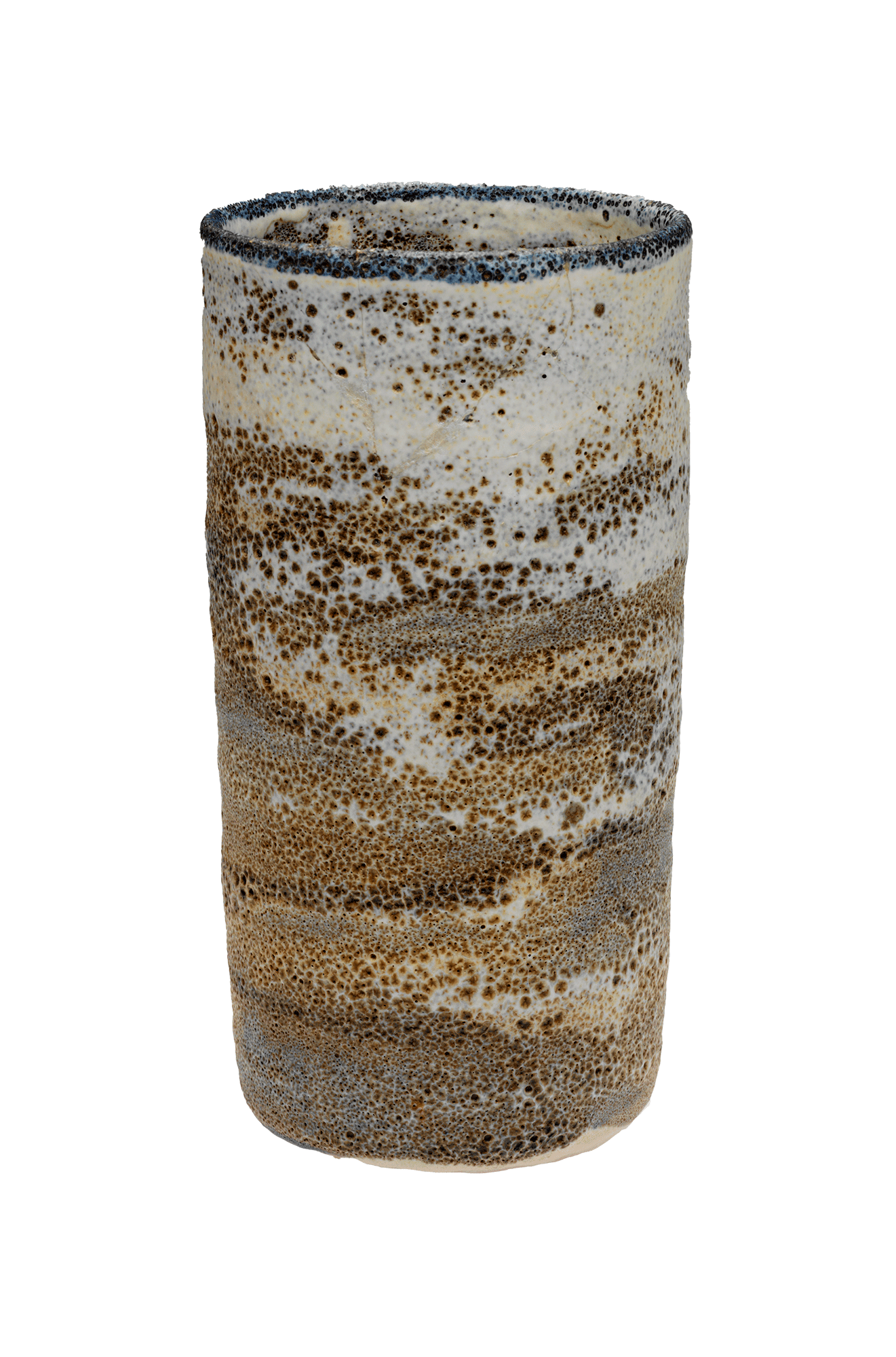A tall, open, cylindrical vessel. It has a dark blue rim and layers of glaze in shades of brown and cream, with a patterning of dots.