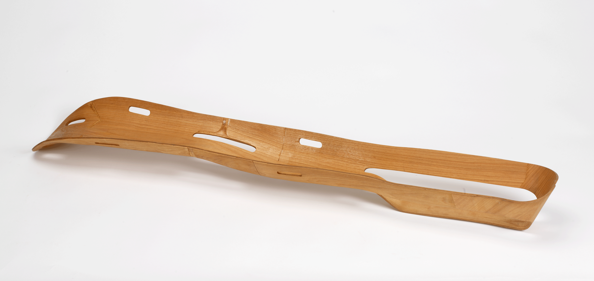 Photo of a wooden support made for leg injuries.