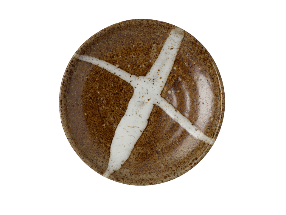 Brown ceramic plate with two white lines criss-crossing