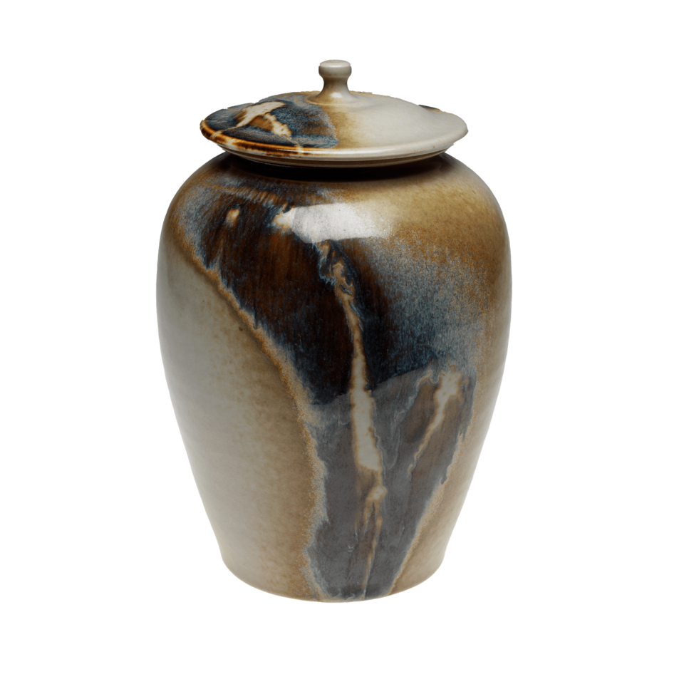 Lidded jar covered in shades of brown, blue, and cream.