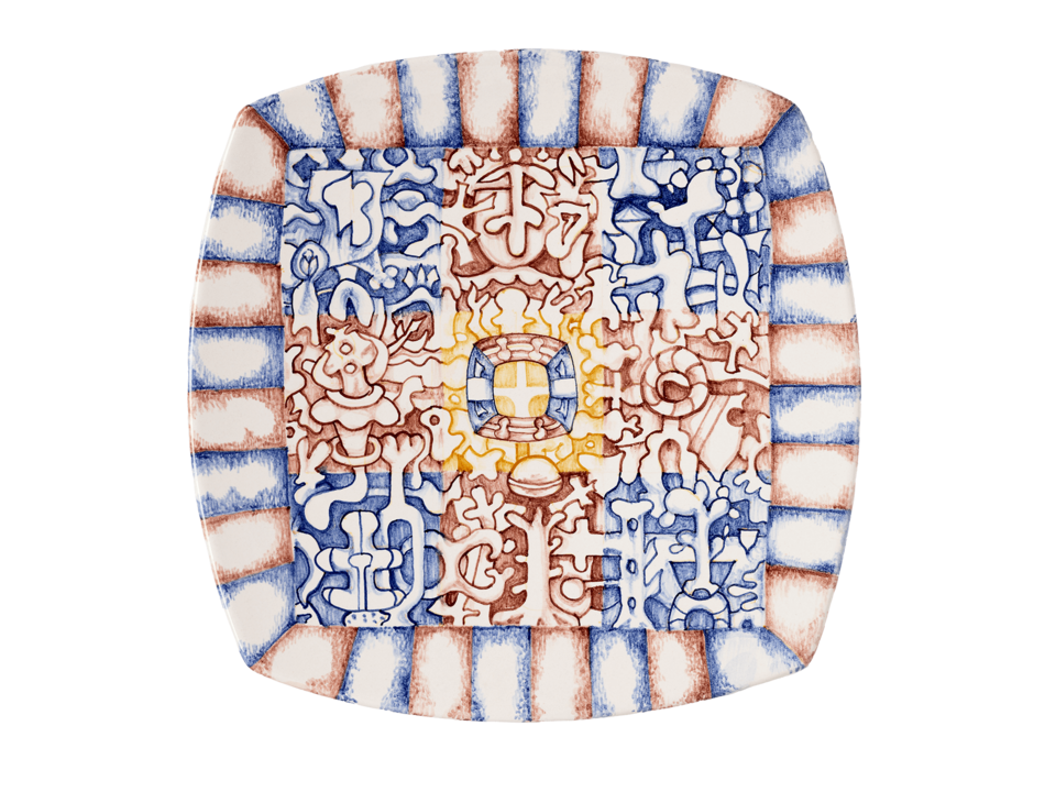 Square plate with rounded sides. Red and blue pattern with yellow in center.