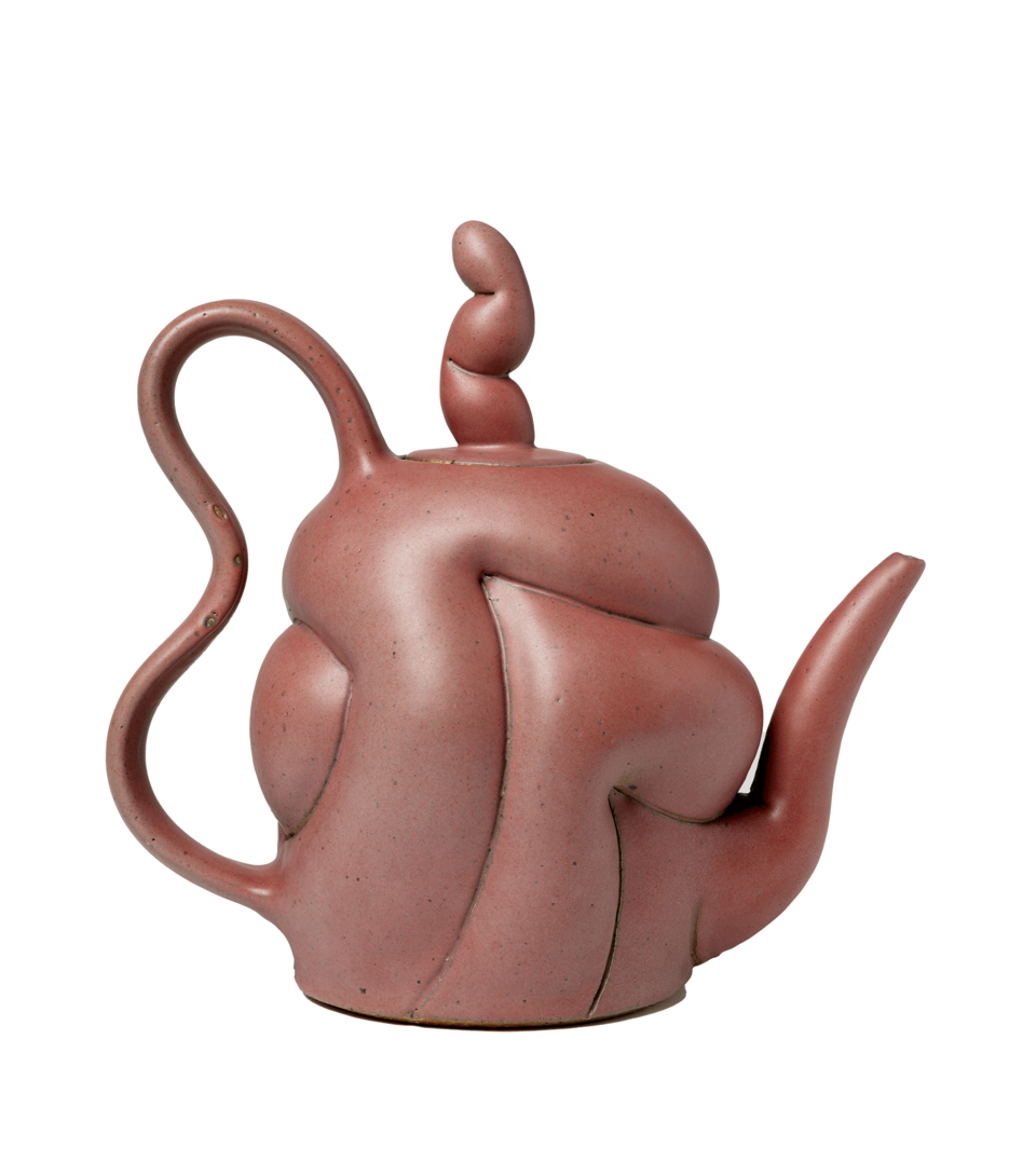 Rust colored teapot in profile with over-exaggerated curves and tall finial. Spout points left and a large curving handle is to the right.