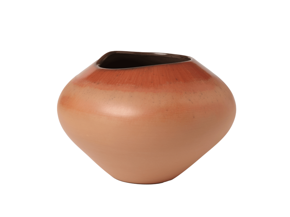 Bulbous tan-orange colored pot with uneven dark colored rim.