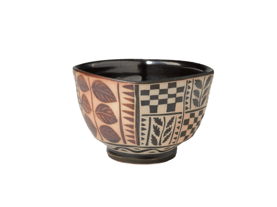 Square bowl with a circular foot. Black interior. Red leaves on either side of a single vine on the left side. Black and tan checkered and leaf decoration on the right side.