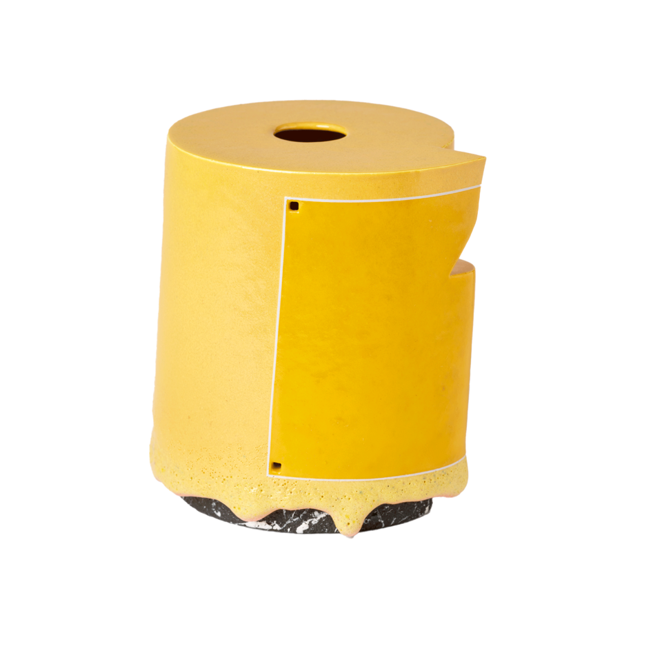 Yellow cylindrical form with a hole in the top. Darker yellow square framed in a white line on the body. Yellow drips over a black base with streaks of white. 